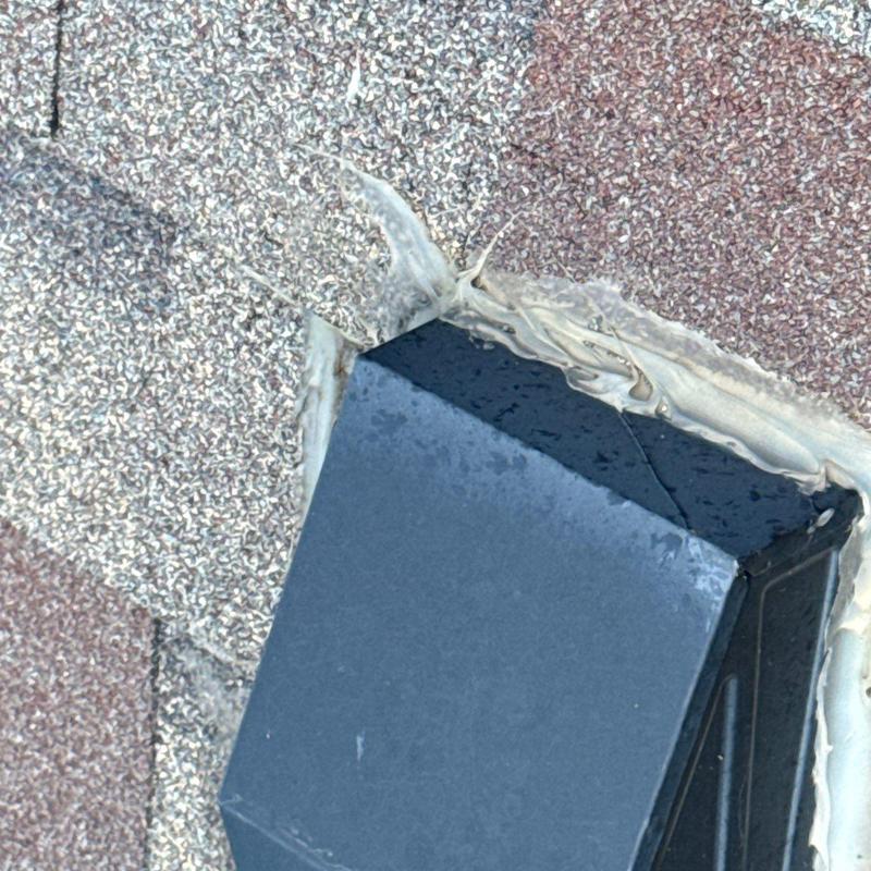 Asphalt shingle roof flashing with sealant damage