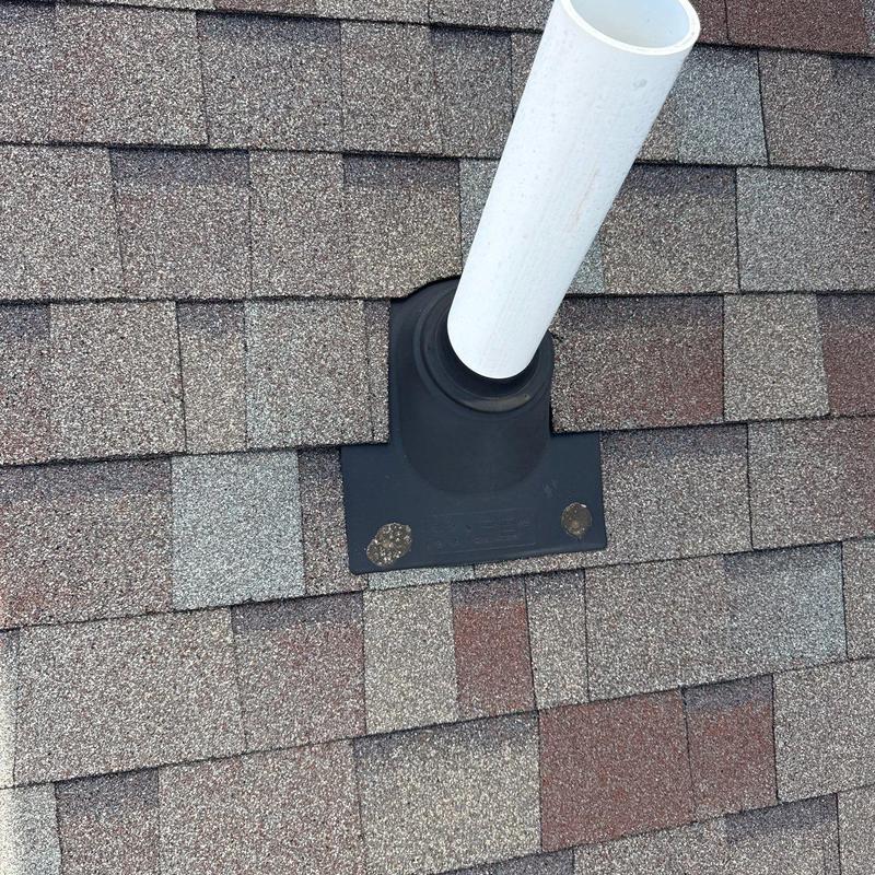 Roof vent pipe flashing on asphalt shingle roof