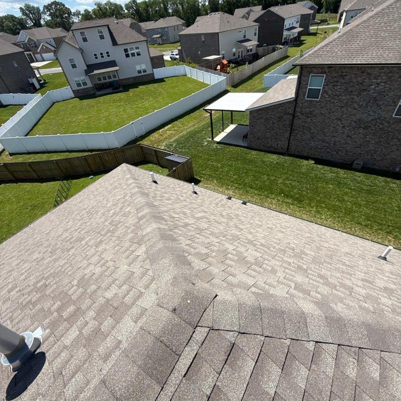 Asphalt shingle roof with ridge vent and flashing inspection