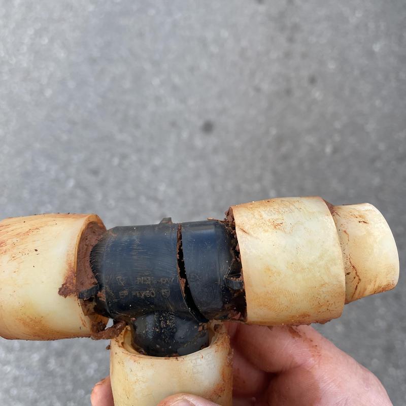 Water service line pipe with cracked fitting and joints