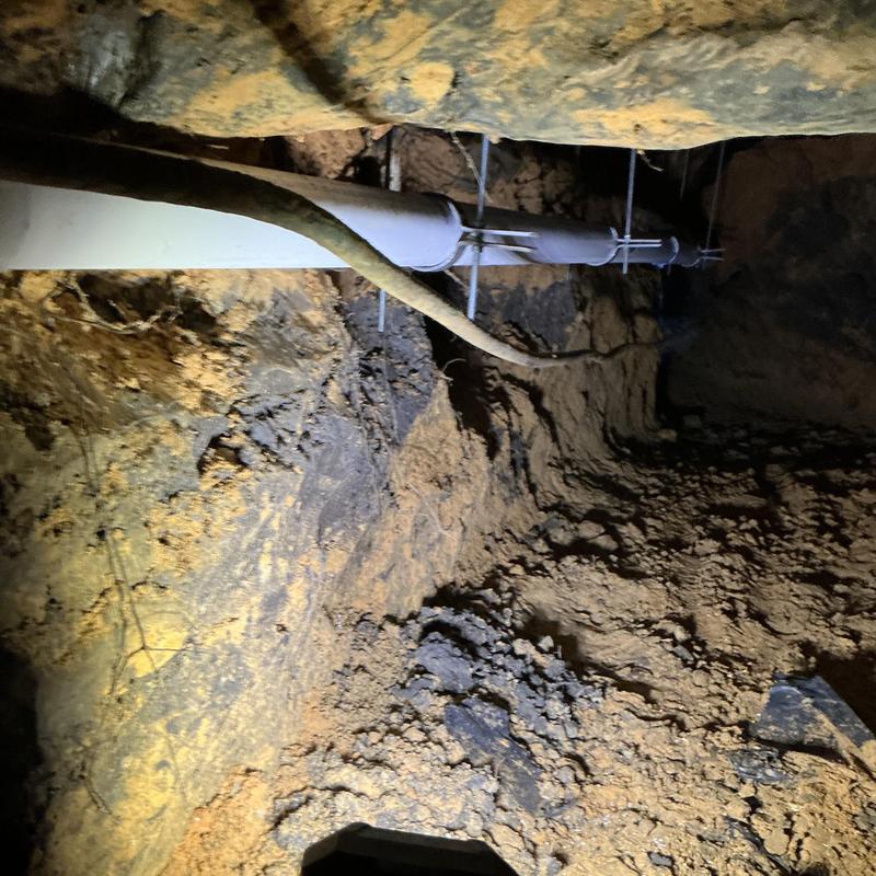 3-inch PVC pipe with hangers installed in tunnel