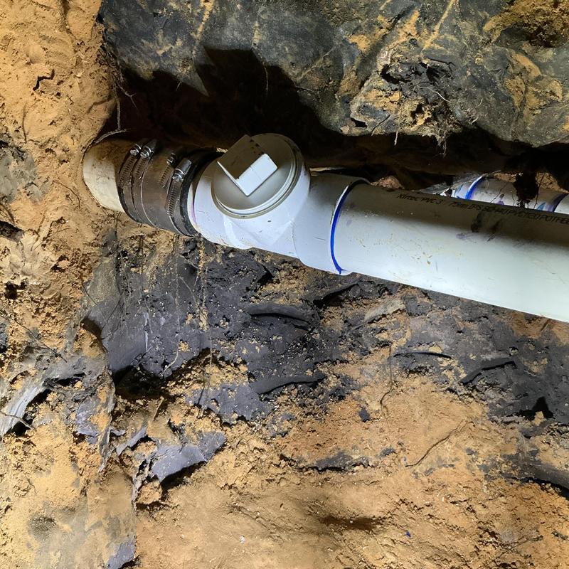 3-inch PVC pipe with cleanout under home tunnel repair