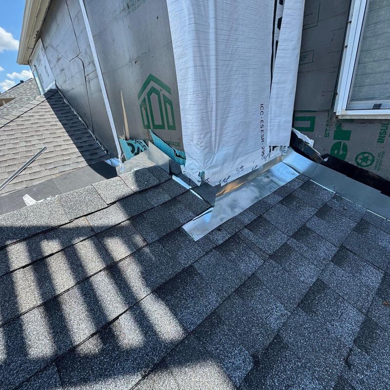 Chimney flashing and roof shingles installation Chimney flashing and roof shingles installation