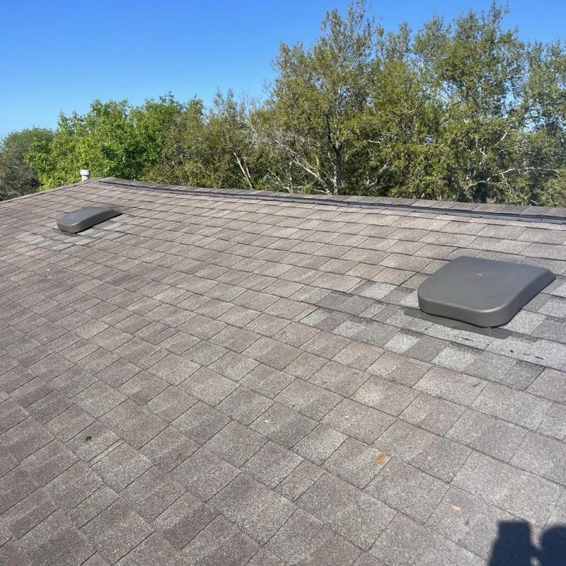 Low-profile static roof vents on asphalt shingle roof