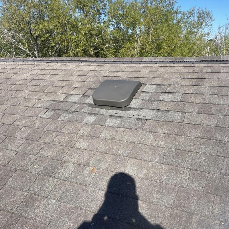 Static roof vent with new flashing on shingle roof