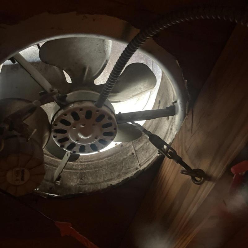 Roof turbine vent and attic fan assembly inside attic