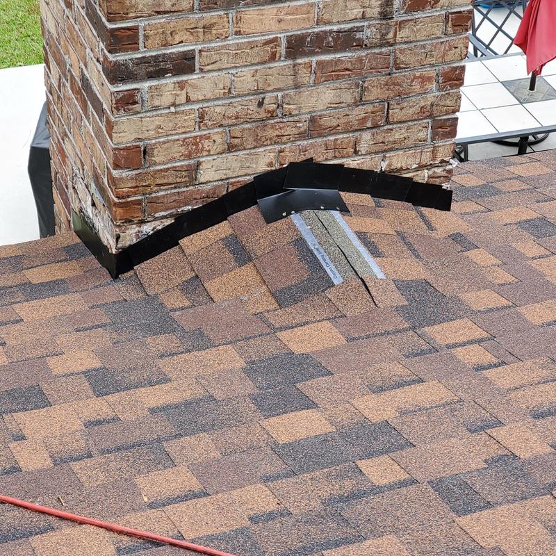 Owens Corning Brownwood shingles at chimney flashing