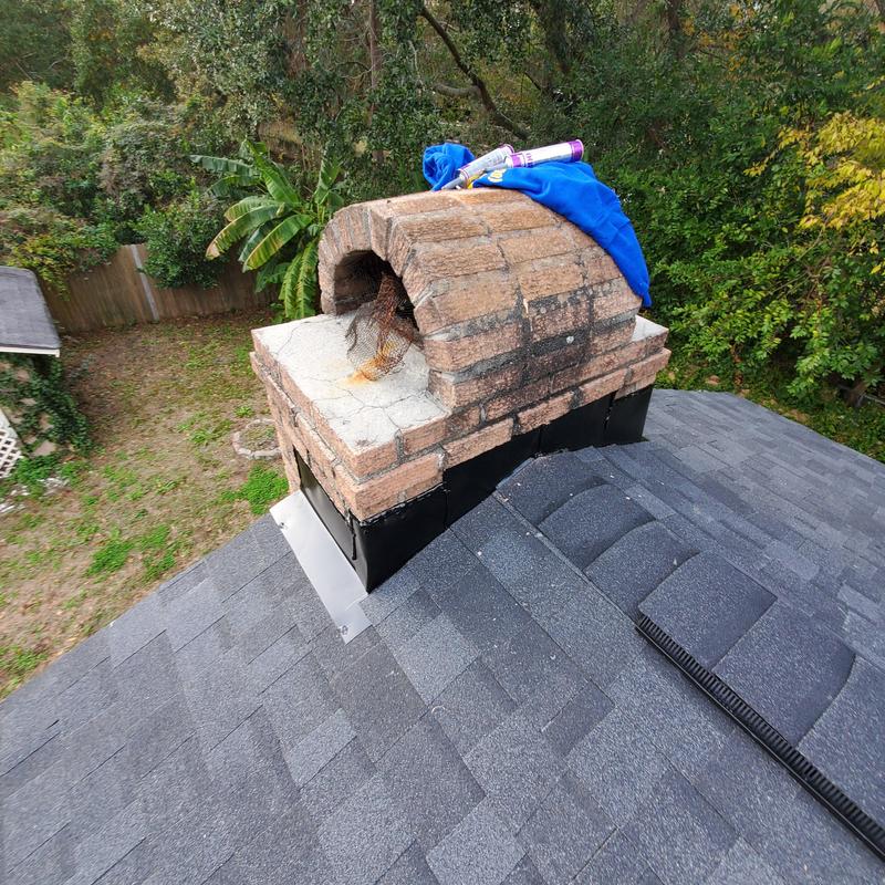 Brick chimney with Owens Corning Oakridge Onyx Black shingles