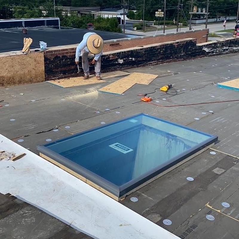 TPO roofing system installation with roof skylight TPO roofing system installation with roof skylight
