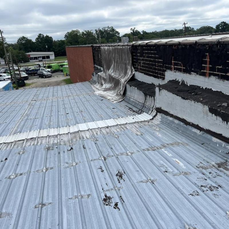 Metal roofing deck removal and wall waterproofing Metal roofing deck removal and wall waterproofing