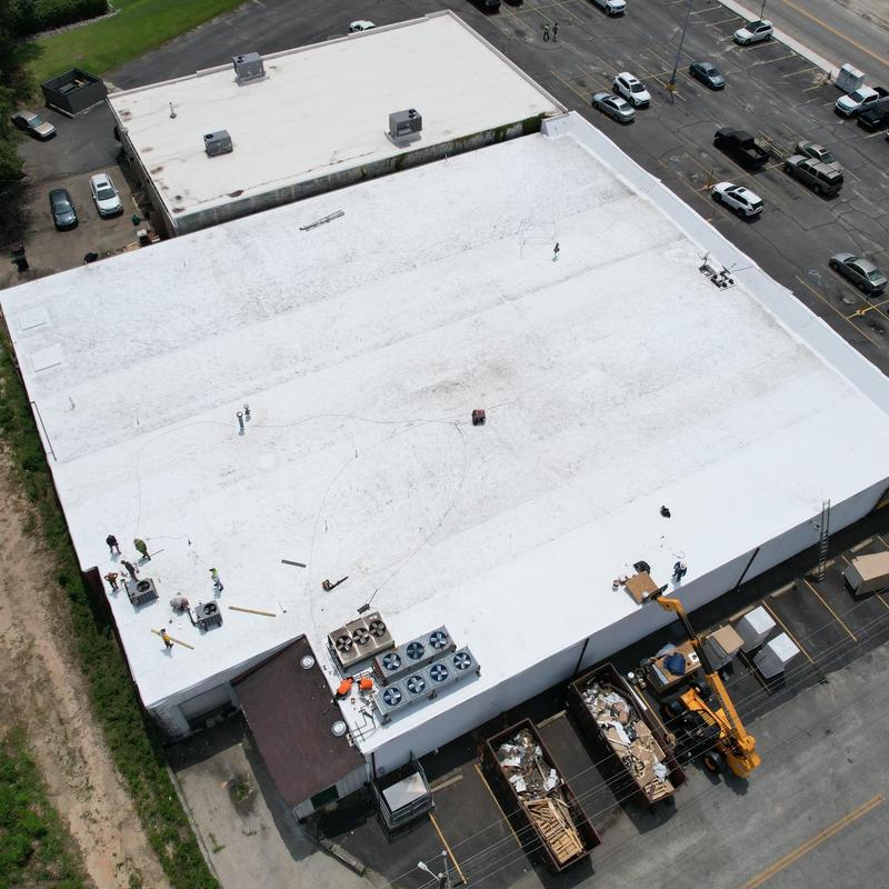 GAF TPO roofing installation on retail store roof GAF TPO roofing installation on retail store roof