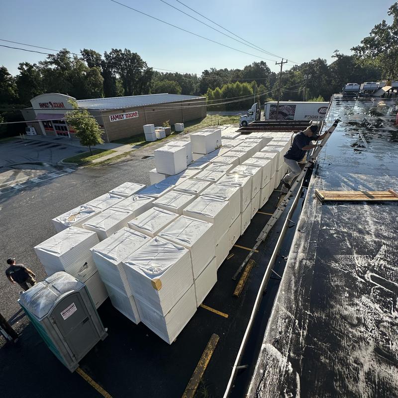 TPO roofing installation with stacked insulation panels TPO roofing installation with stacked insulation panels