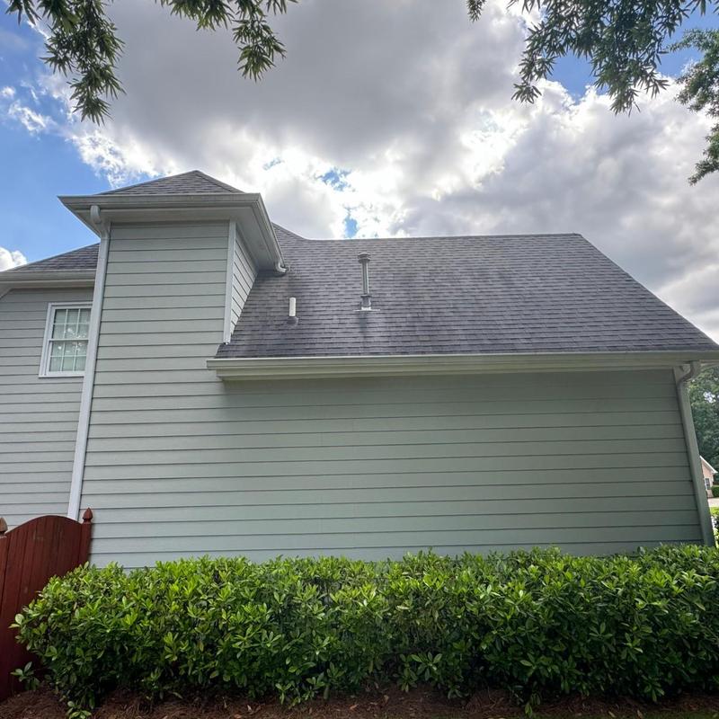 Chimney flashing and siding on house exterior