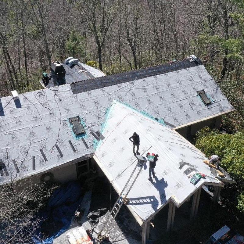 Roof underlayment installation on mountain home roof