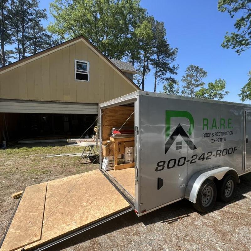 Roof shingles and siding materials loaded in trailer