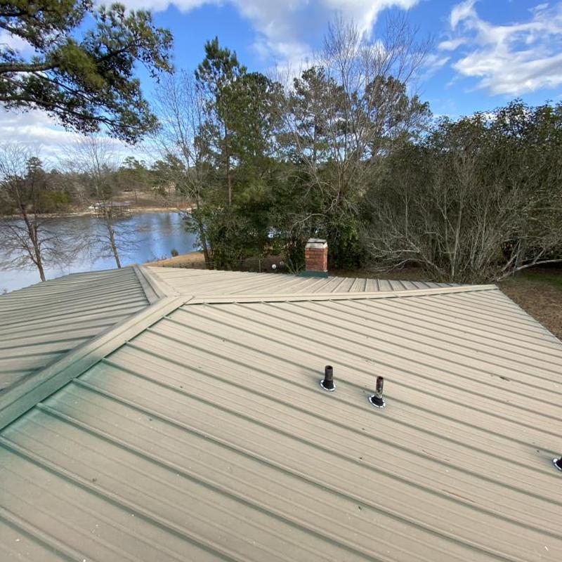 Galvalume metal roof panels over lake view