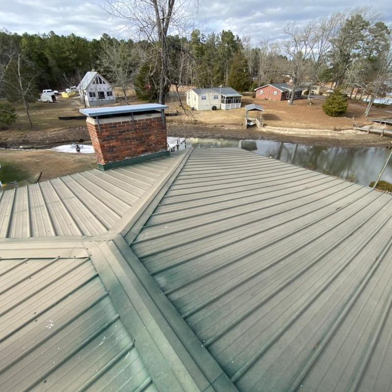 Galvalume metal roof panels over lake view