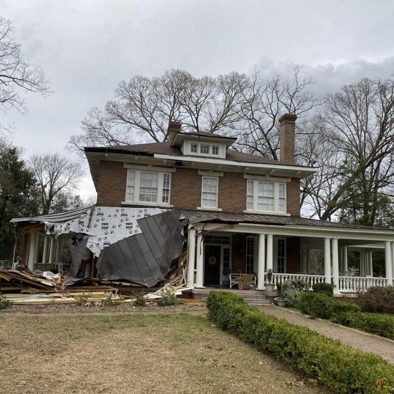 Roof and porch storm damage on historic home Roof and porch storm damage on historic home