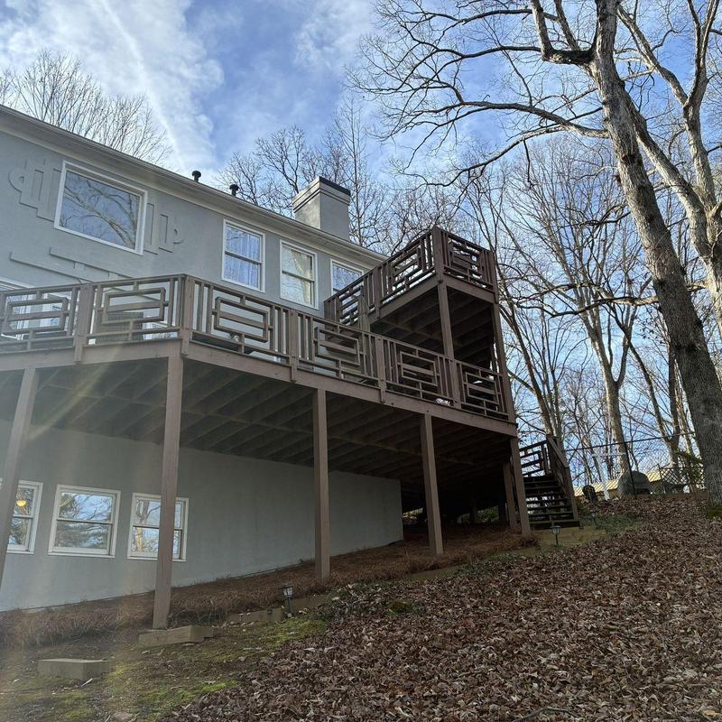 Wooden deck with structural supports and railings