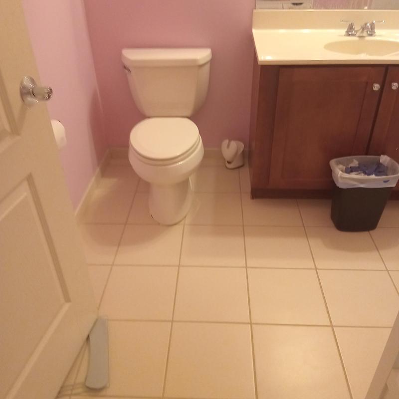 Toilet installation in residential bathroom with sink vanity Toilet installation in residential bathroom with sink vanity