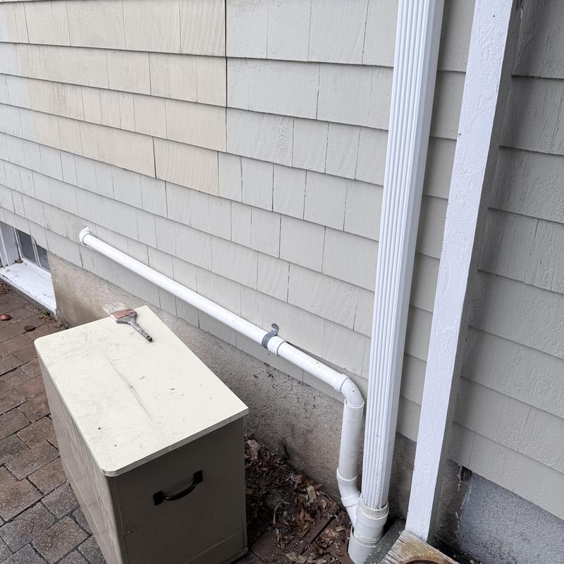 Exterior drain pipe installation on house siding Exterior drain pipe installation on house siding