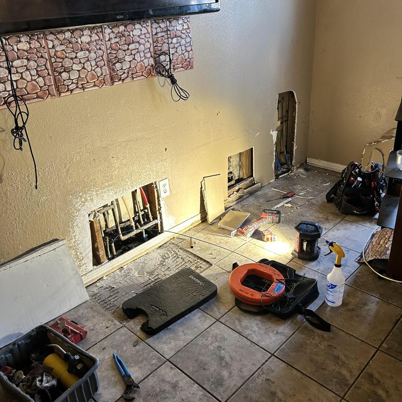 Copper pipe slab leak access and reroute work site