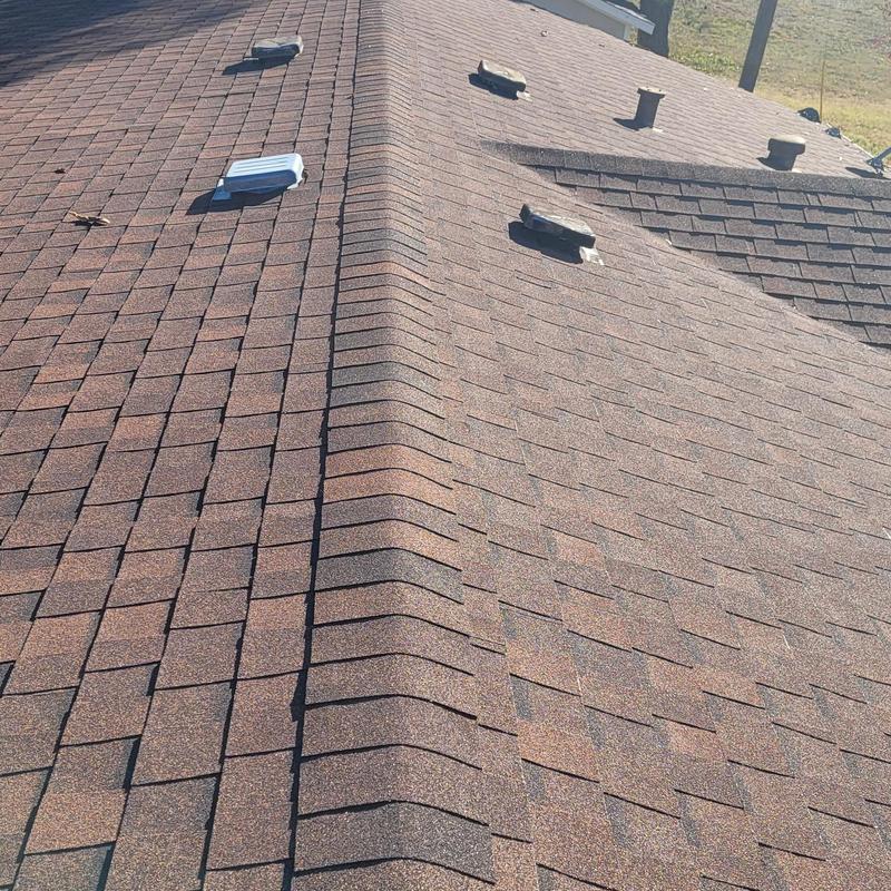 Asphalt shingle roof with hail and wind damage in Terrell TX