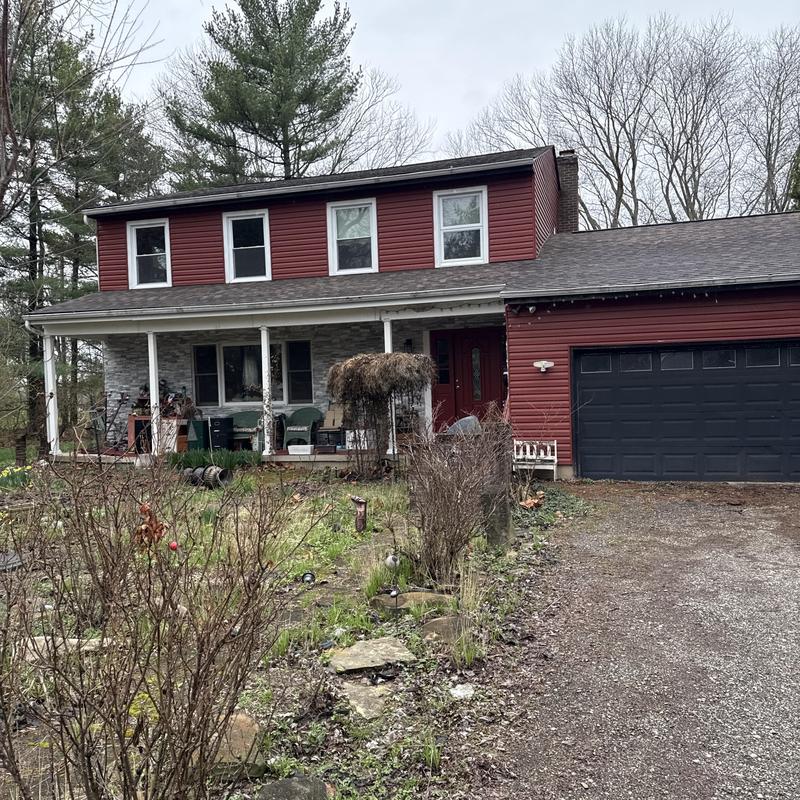 Roof shingles and gutter inspection on house exterior Roof shingles and gutter inspection on house exterior