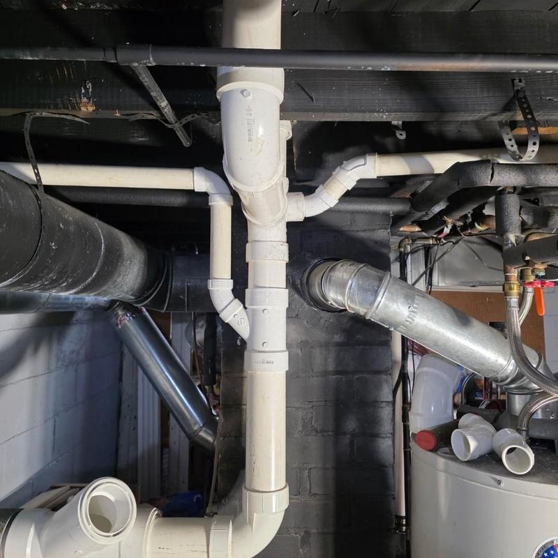 PVC plumbing stack replacement in basement ceiling