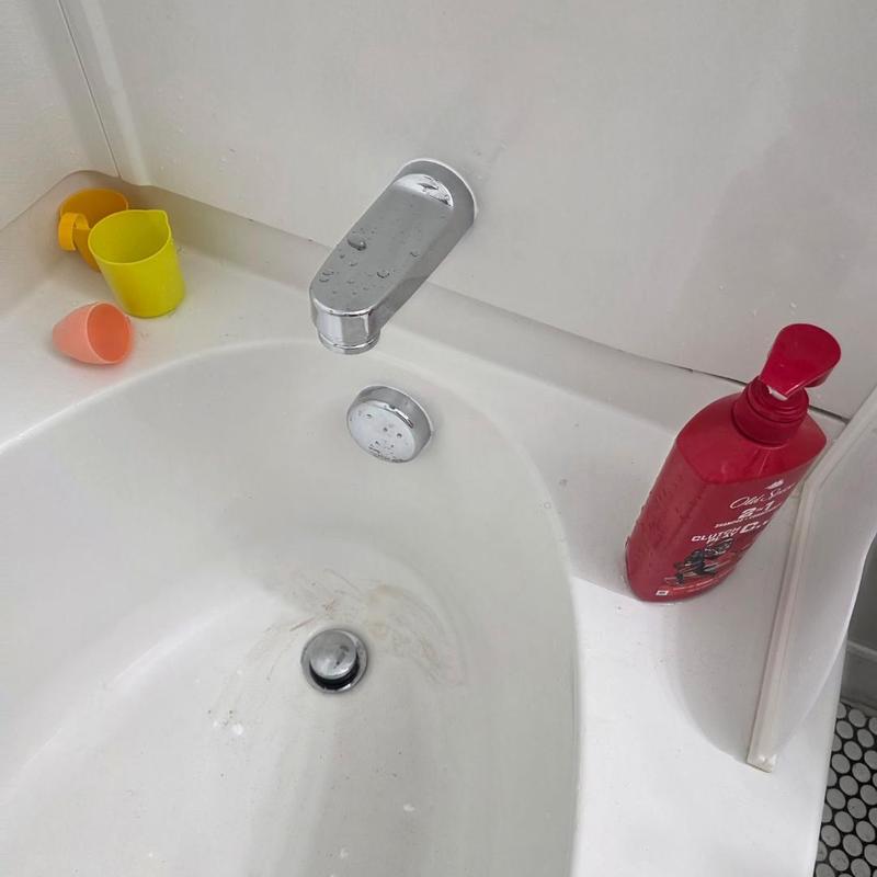 Bathroom tub faucet and drain with soap bottle