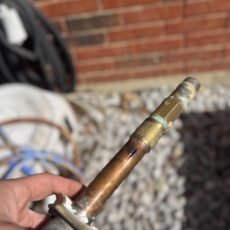 Hose bib damaged by freeze split close-up view