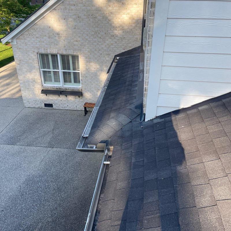 Asphalt shingle roof with gutters and downspout inspection