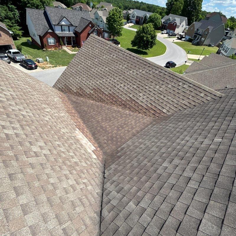 Asphalt shingle roof valleys with hail damage