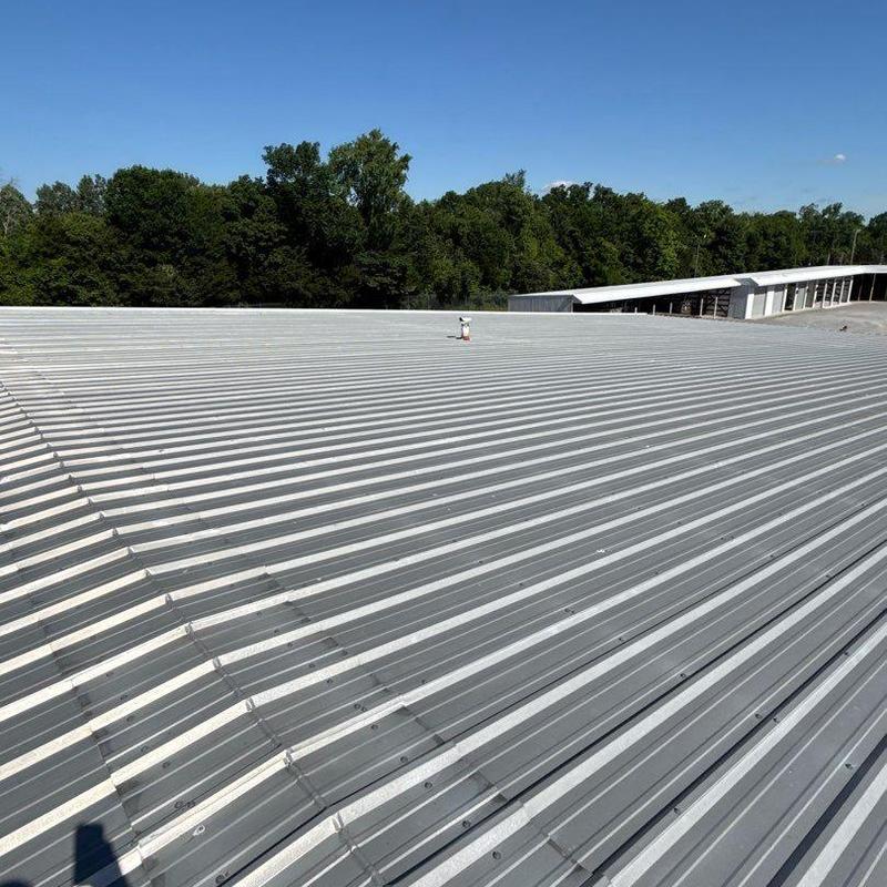 Metal commercial roofing with hail damage inspection