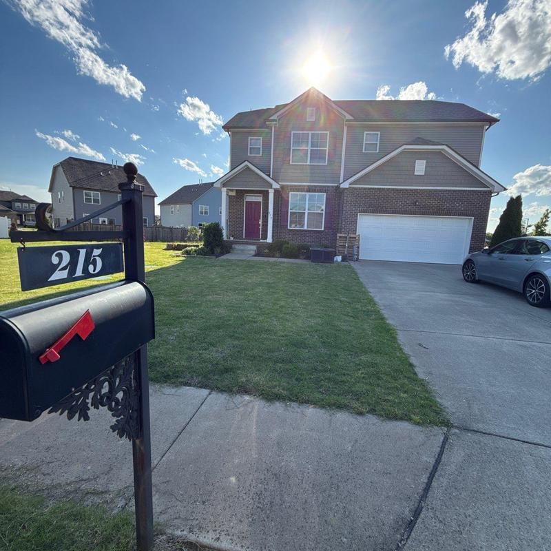 Roof shingles with hail damage on suburban house