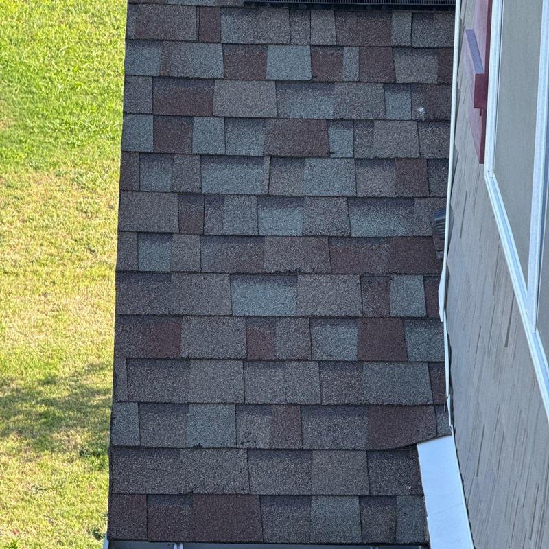 Asphalt shingle roof with hail damage on granules