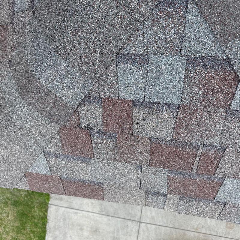 Roof shingles with hail damage and missing granules