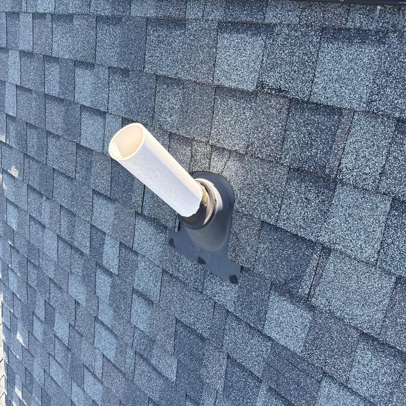 Roof vent pipe flashing on asphalt shingle roof
