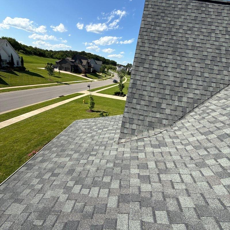 Asphalt shingle roof with flashing at roof valley