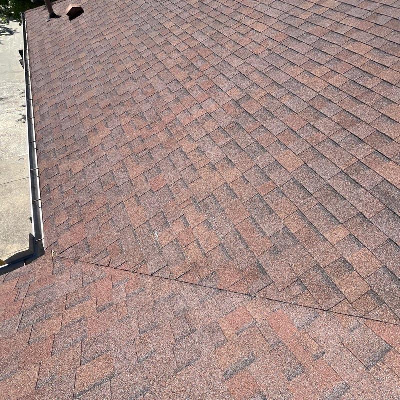 Asphalt shingle roof with hail damage inspection