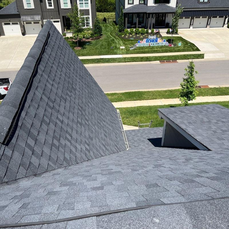 Roof shingles with hail damage on residential home