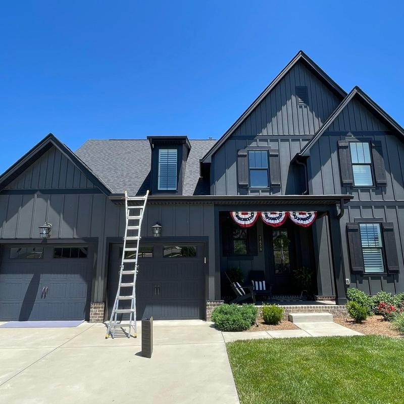 Asphalt shingle roof with ladder for inspection