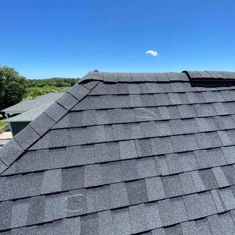 Asphalt shingle roof with hail damage markings