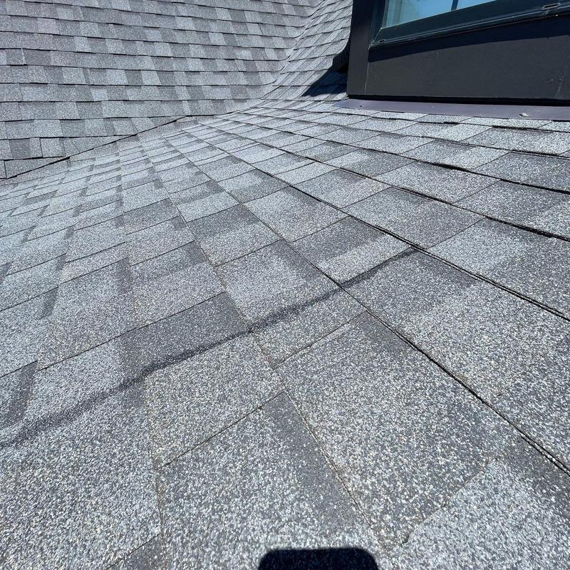 Asphalt shingle roof with flashing and ridge vent inspection