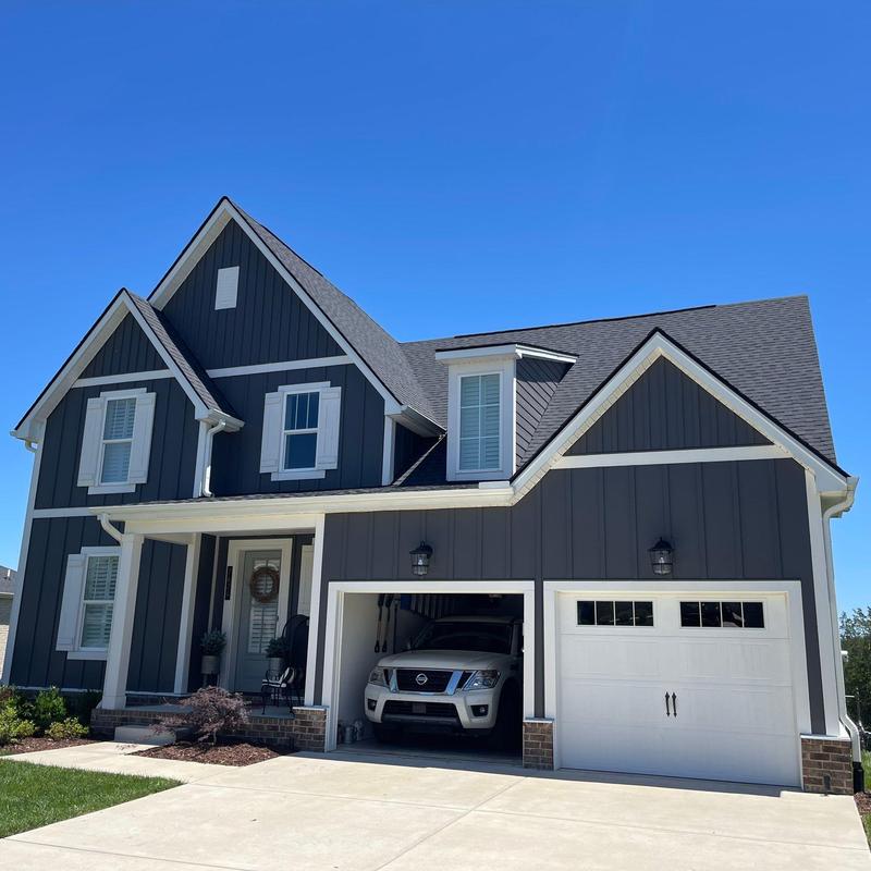 Roof shingles with hail damage inspection on house