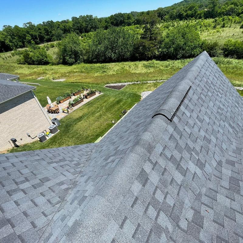 Asphalt shingle roof with ridge vent and no visible damage
