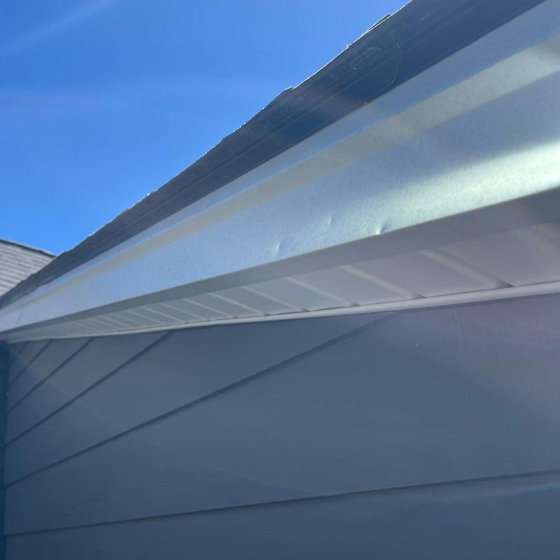 Vinyl soffit and fascia with hail damage dents