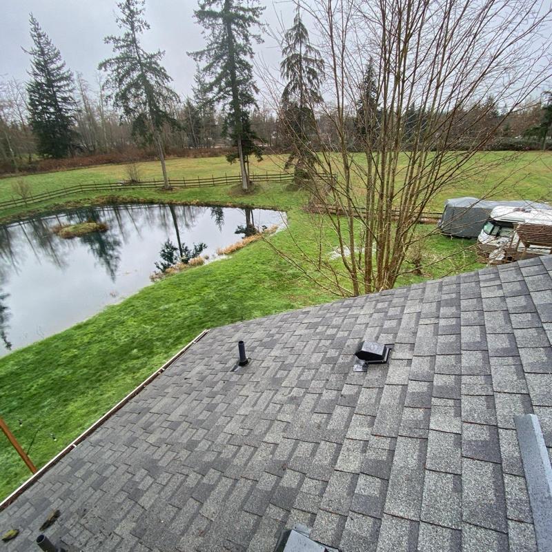 Pipe flashing and flapper vents on asphalt shingle roof