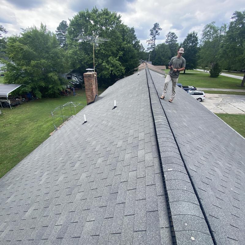Oakridge Estate Gray shingle roof installation with new gutters Oakridge Estate Gray shingle roof installation with new gutters