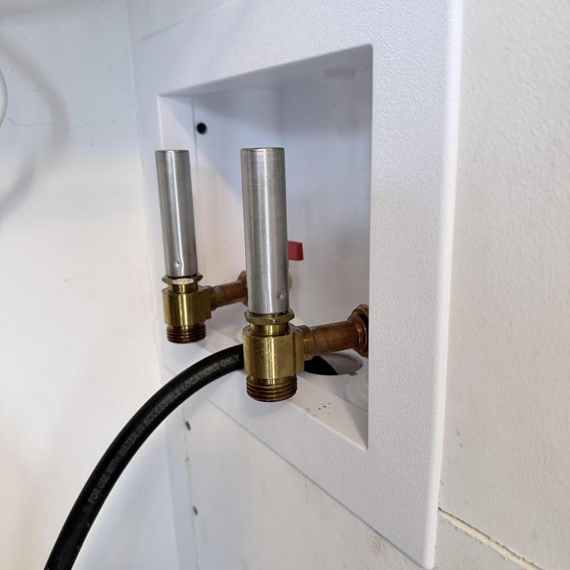 Laundry valve box with new brass valves installed